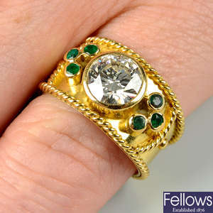 An 18ct gold brilliant-cut diamond collet ring, with emerald and rope-twist sides, by Annabel Jones.