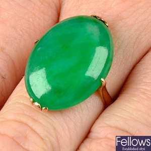 A mid 20th century gold A-Type Imperial jade cabochon ring.