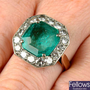 A mid 20th century silver and gold, emerald and brilliant-cut diamond ring.