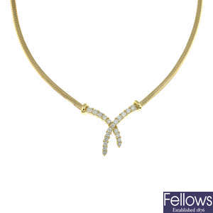 A 9ct gold diamond cross pendant necklace.