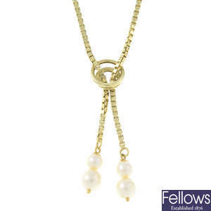 A cultured pearl lariat necklace.