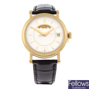 PATEK PHILIPPE - an 18ct yellow gold Calatrava wrist watch, 37mm.