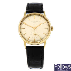 PATEK PHILIPPE - an 18ct yellow gold Calatrava wrist watch, 33.5mm.