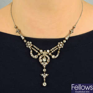 A late 19th century silver and gold old-cut diamond drop necklace, with later 18ct gold back-chain.