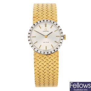 OMEGA - a yellow metal De Ville bracelet watch, 24mm.