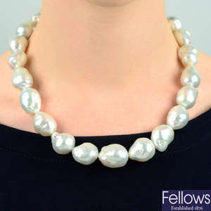 A South Sea baroque cultured pearl necklace, with diamond clasp, by Mikimoto.