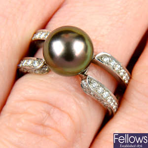 A platinum 'Black South Sea' cultured pearl and brilliant-cut diamond ring, by Mikimoto.