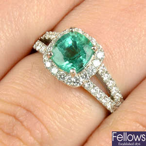 An emerald and brilliant-cut diamond ring.