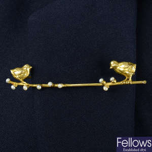 An early 20th century Austrian 14ct gold brooch, depicting two chicks upon a seed pearl budding branch.