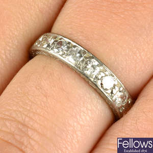A brilliant-cut diamond half eternity ring.