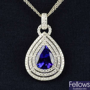 An 18ct gold tanzanite and brilliant-cut diamond pendant, on diamond accent two-row chain.