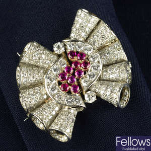 A 1940s palladium and gold ruby and pavé-set diamond double clip brooch.
