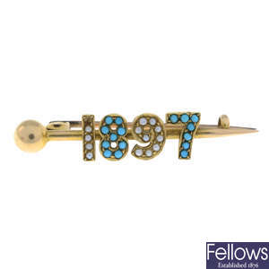 A late Victorian gold turquoise and split pearl '1897' brooch.