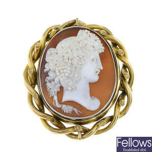 A late Victorian shell cameo brooch, carved to depict Dionysus in profile.