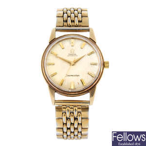 OMEGA - a 9ct yellow gold Seamaster bracelet watch, 34mm.