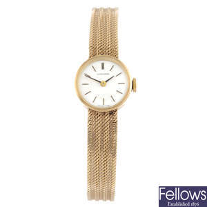 LONGINES - a 9ct yellow gold bracelet watch, 18mm.