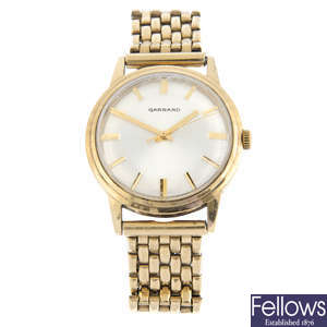 GARRARD - a 9ct yellow gold bracelet watch (34mm) with a 9ct yellow gold Rotary wrist watch.