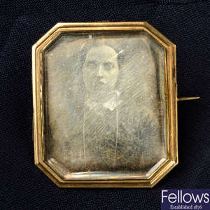 A mid 19th century daguerreotype photographic memorial brooch, with woven hair glazed locket and engraved reverse.