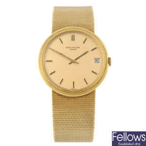 PATEK PHILIPPE - a yellow metal Calatrava bracelet watch, 33mm.