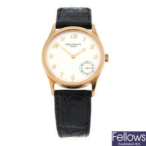 PATEK PHILIPPE - an 18ct rose gold Calatrava wrist watch, 33mm.