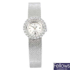 ROLEX - a factory diamond set white metal Precision bracelet watch, 16mm.