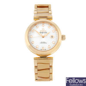 OMEGA - a rose gold Ladymatic Co-Axial bracelet watch, 33mm.
