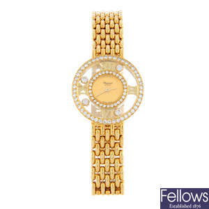 CHOPARD - a factory diamond set 18ct yellow gold Happy Diamonds bracelet watch, 24mm.