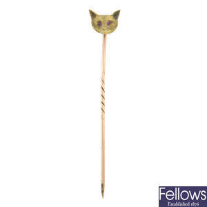 An early 20th century gold fox head stickpin, with ruby eyes.