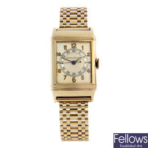 JAEGER-LECOULTRE - a 9ct yellow gold Reverso bracelet watch, 23x38mm.