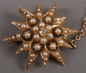 Edwardian 15ct gold star brooch with central old