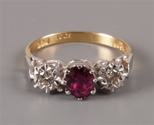 18ct gold oval ruby and illusion set diamond