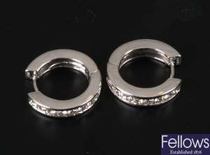 Pair of white gold channel set diamond hoop