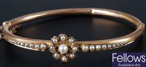 Early 20th century gold hinged bangle with seed