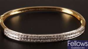 9ct gold diamond set hinged bangle, with central