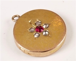 Ruby and old cut circular locket (high carat).