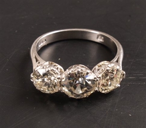 Platinum mounted three stone old cut diamond ring