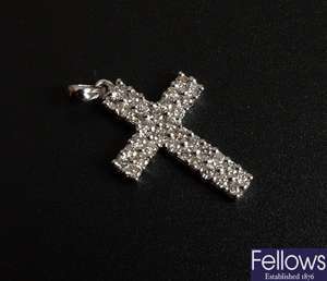 18k white gold diamond set cross pendant.