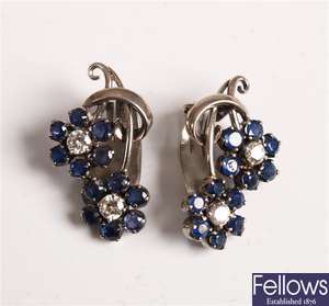 14K white gold floral formed earrings set with