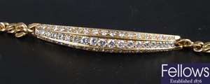 18ct gold curb link bracelet with a central