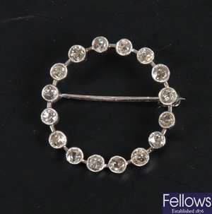 White metal circular diamond brooch with hollow