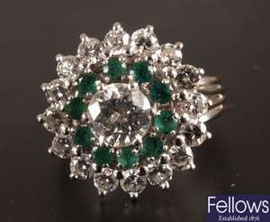 Diamond and emerald cluster ring mounted in 18ct