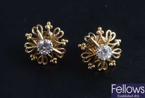 Pair of diamond stud earrings of some 0.55ct each