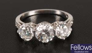 Cllaw set three stone diamond ring of some
