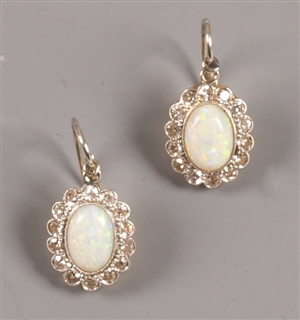 Pair of oval opal and diamond cluster earrings