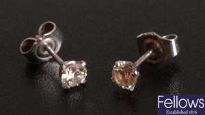 Round brilliant diamond set stud earrings.