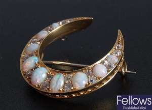 Diamond and opal set crescent shape brooch, nine