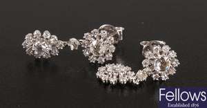 A pair of 18ct white gold diamond set cluster