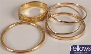 Five assorted 9ct rolled gold bangles.