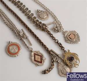 A selection of silver Albert chains and base