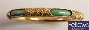 Asian gold hinged bangle with inserted jade